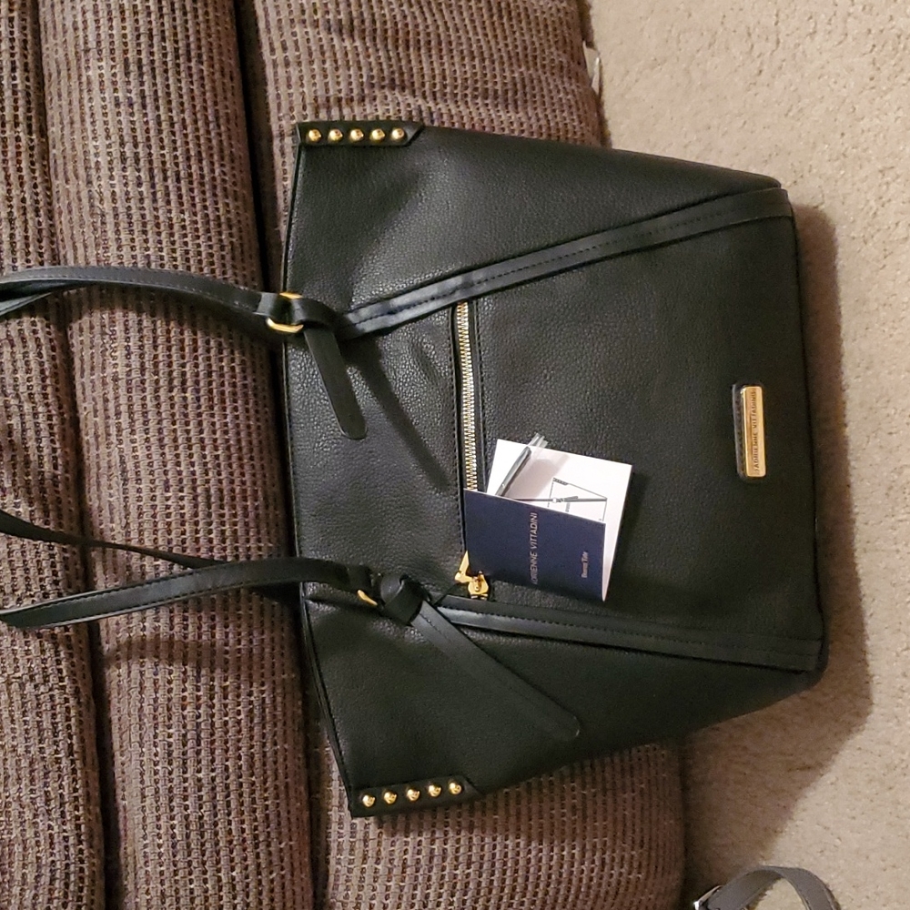 Black bag Adrienne Vittadini.  Pocket in the front with a zipper.